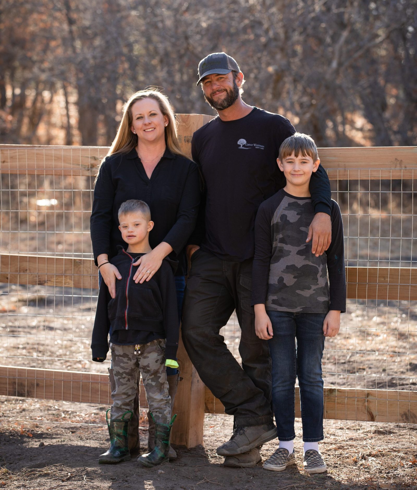 The Szpunar family, founders of Great Western Tree Care, standing together outdoors in Colorado